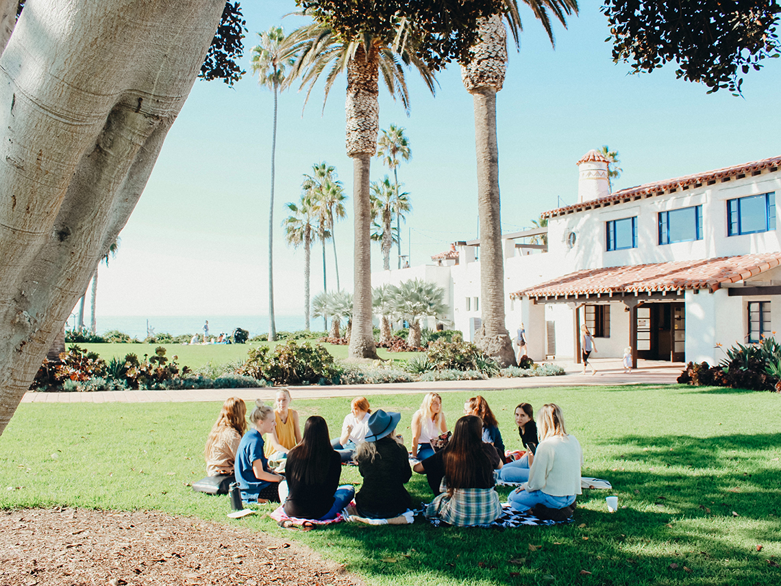 People in grassy field