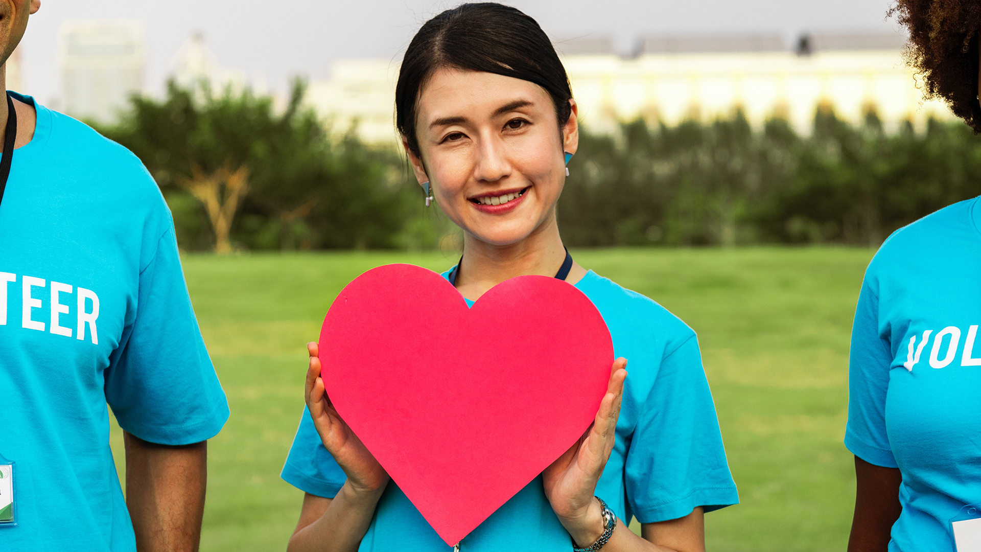 young woman holding heart