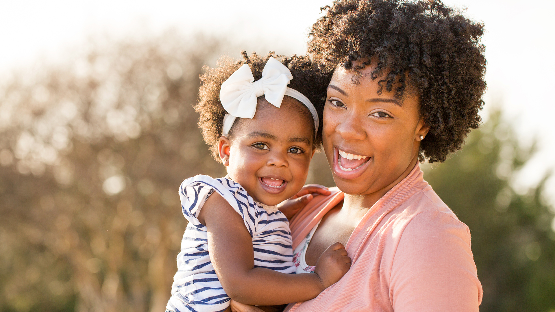 young mother and child smiling